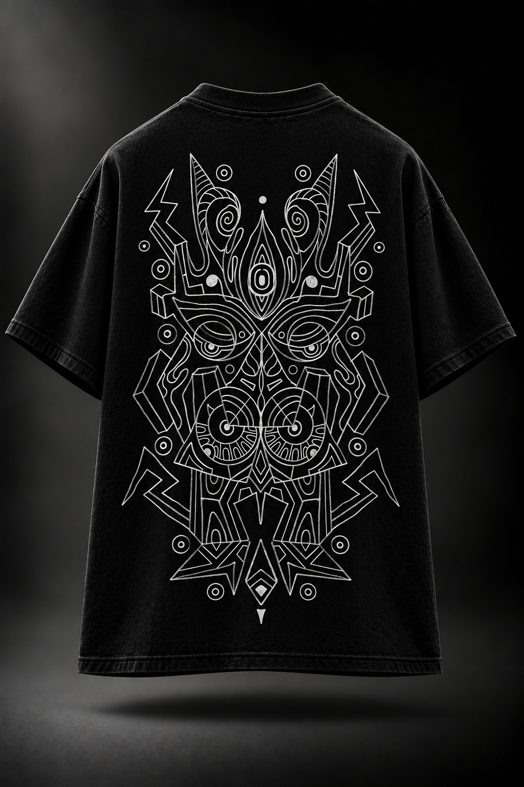 A black LMNO t-shirt shown from the back, featuring a large white line-art graphic of a stylized mask or face with circular and geometric details.