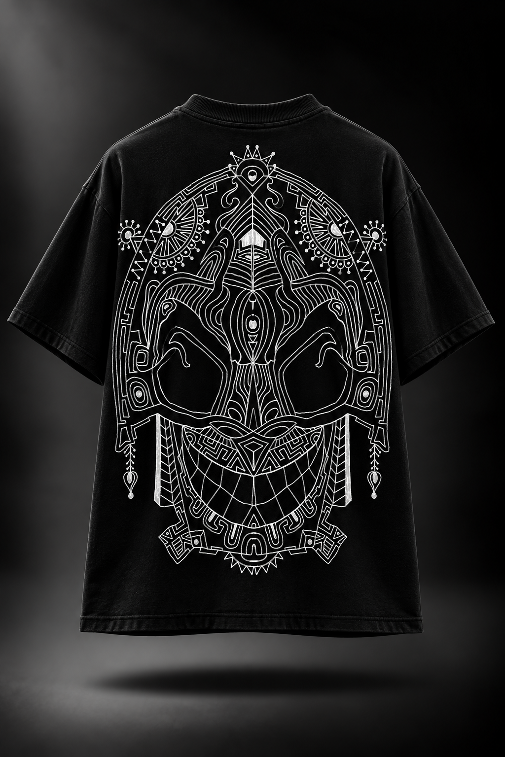 A black LMNO t-shirt with a large white mandala-style graphic on the back, displayed against a dark studio background.