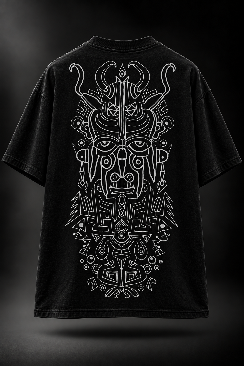 A black LMNO t-shirt, featuring a large white line-art graphic of a stylized horned face with intricate geometric and tribal-inspired details.