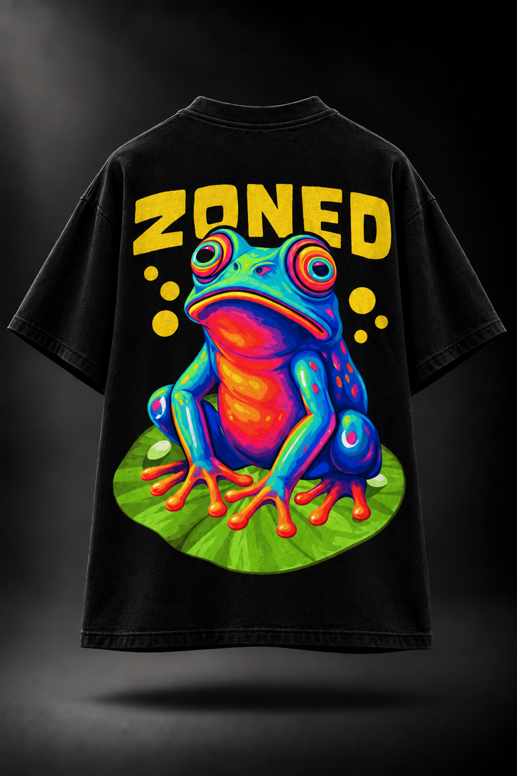 A black LMNO t-shirt, featuring a large graphic print of a colorful frog sitting on a green leaf with the word 'ZONED' in bold yellow letters above it.
